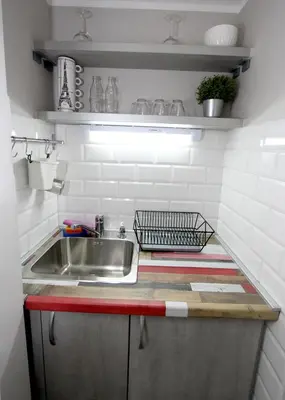a kitchen with a sink and a counter top at City Center Apartment MIKA in Belgrade