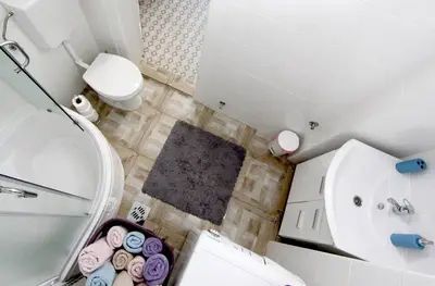 a small bathroom with a toilet and a sink at City Center Apartment MIKA in Belgrade