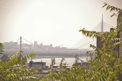 a bridge over a river with a city in the background at Bridge apartment in Belgrade