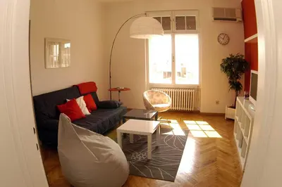 a living room with a couch and a table at Bridge apartment in Belgrade