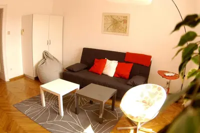 a living room with a couch and two tables at Bridge apartment in Belgrade