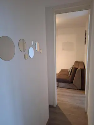 a hallway with mirrors on the wall of a room at WHITE CITY 2 in Belgrade