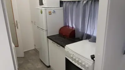 a small kitchen with a refrigerator and a microwave at WHITE CITY 2 in Belgrade