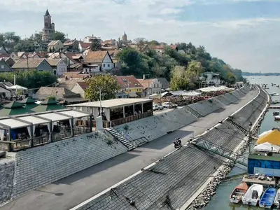 a street in a town next to a body of water at New Residence in Belgrade
