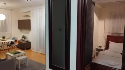 two images of a bedroom and a living room at New Residence in Belgrade