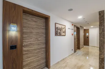 a hallway with a sliding door in a building at Abba Hotel in Belgrade