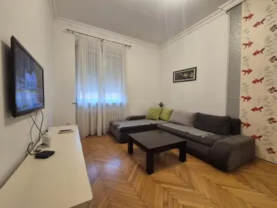 a living room with a couch and a table at Dositej 5 Apartment in Belgrade