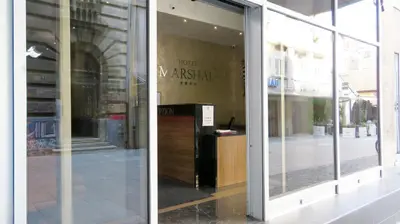 a window of a store with a desk in it at Hotel Marshal Garni in Belgrade