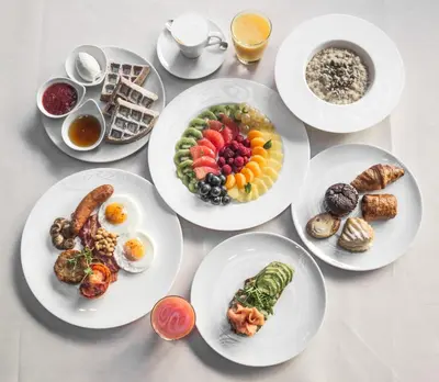 a group of plates of food on a table at Square Nine Hotel Belgrade-The Leading Hotels of The World in Belgrade