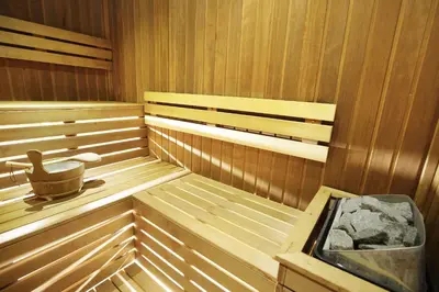 a wooden sauna with a bucket in it at Square Nine Hotel Belgrade-The Leading Hotels of The World in Belgrade