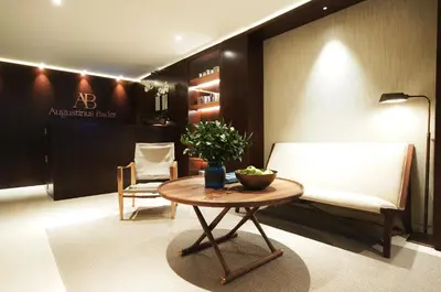 a room with a couch and a table and a chair at Square Nine Hotel Belgrade-The Leading Hotels of The World in Belgrade