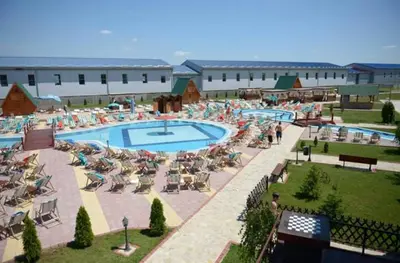 a swimming pool with lounge chairs and a resort at B&B Queen in Belgrade