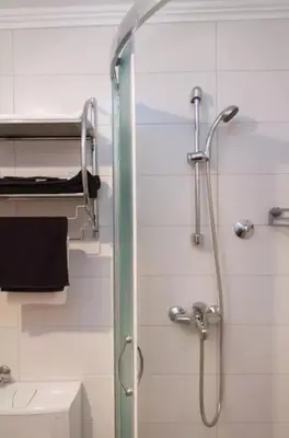 a shower with a glass door in a bathroom at Modern Cozy Apartment in Belgrade