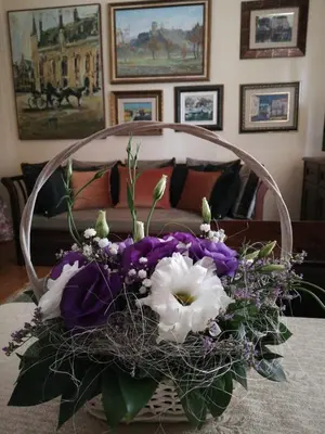 a bouquet of purple and white flowers on a table at Classic Style Apartment in Belgrade