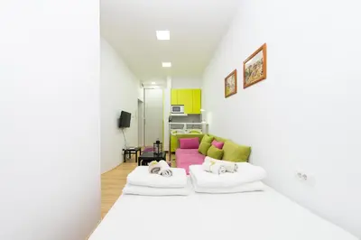 a living room with two beds and a couch at Balkan-inn Apartment Terazije in Belgrade