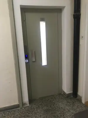 a door with a window on it in a room at Penthouse Novi Beograd in Belgrade