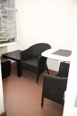 a table and two chairs and a table and a table at Apartman Green relax Belville in Belgrade