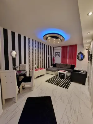 a living room with a couch and a table at Black & White in Belgrade