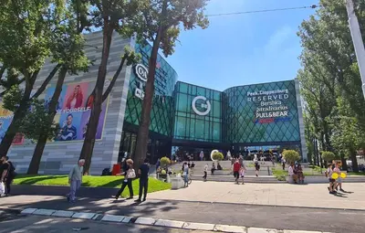 a group of people walking in front of a building at Black & White in Belgrade