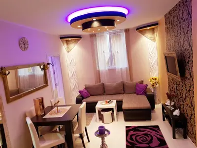 a living room with a couch and a table at Gold in Belgrade