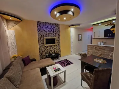 a living room with a couch and a table at Gold in Belgrade