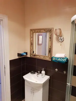 a bathroom with a sink and a mirror at Gold in Belgrade