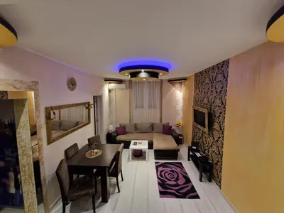 a living room with a couch and a table at Gold in Belgrade