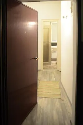 a door leading into a room with a hallway at Kate Apartment Belgrade in Belgrade