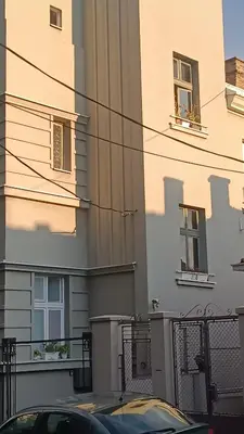 a car parked in front of a building at Jelena Apartment in Belgrade