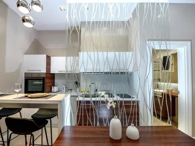 a kitchen with a vase with flowers in it at Main Square Residence in Belgrade