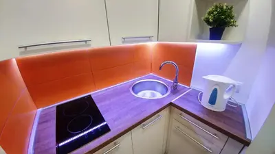 a kitchen with a sink in a counter top at Dafni Apartment in Belgrade