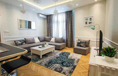 a living room with a couch and a piano at Apartment Passage in Belgrade
