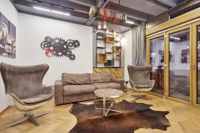 a living room with a couch and two chairs and a table at Subway in Belgrade