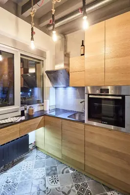 a kitchen with wooden cabinets and a sink at Subway in Belgrade