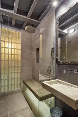 a bathroom with a glass shower and a sink at Subway in Belgrade