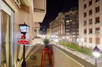 a window with a street view of a city at night at Subway in Belgrade