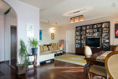 a living room with a couch and a table at Roof Penthouse 15th Floor in Belgrade