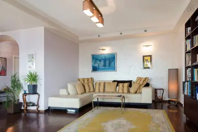 a living room with a couch and a table at Roof Penthouse 15th Floor in Belgrade