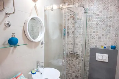 a bathroom with a shower and a sink at Atelje apartment in Belgrade
