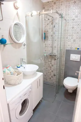 a bathroom with a sink and a toilet and a shower at Atelje apartment in Belgrade