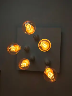 a group of lights on a ceiling in a room at Charming Flat with Soul in Belgrade