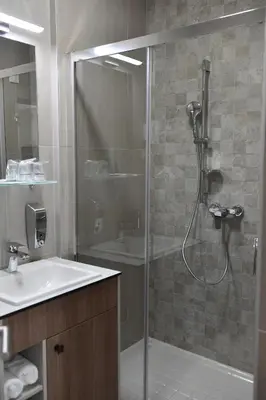 a bathroom with a shower and a sink at Apartments Srbija - FREE PARKING in Belgrade