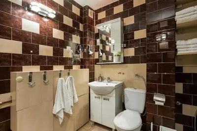 a bathroom with a toilet and a sink at Belgrade Sky Apartment in Belgrade