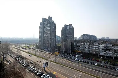 a city with tall buildings and a highway with cars at Apartment Bella Art in Belgrade