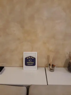 a sign sitting on top of a white table at Apartman Centar Bg in Belgrade