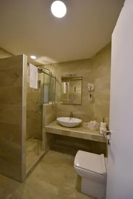 a bathroom with a sink and a toilet and a shower at Apartman Centar Bg in Belgrade