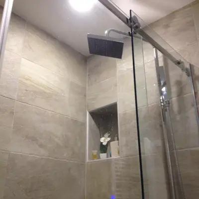 a shower with a glass door in a bathroom at Apartman Centar Bg in Belgrade