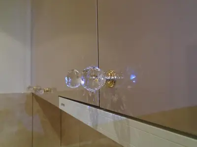 a display of glass spheres on a wall at Apartment Bourgeois in Belgrade