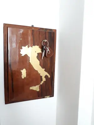 a key hanging on a wall with a key chain at Prenociste Nikolas Grand in Smederevo