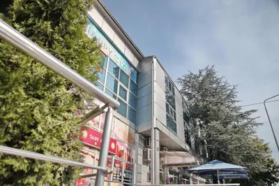 a building with a sign on the side of it at Happy Star Club in Belgrade